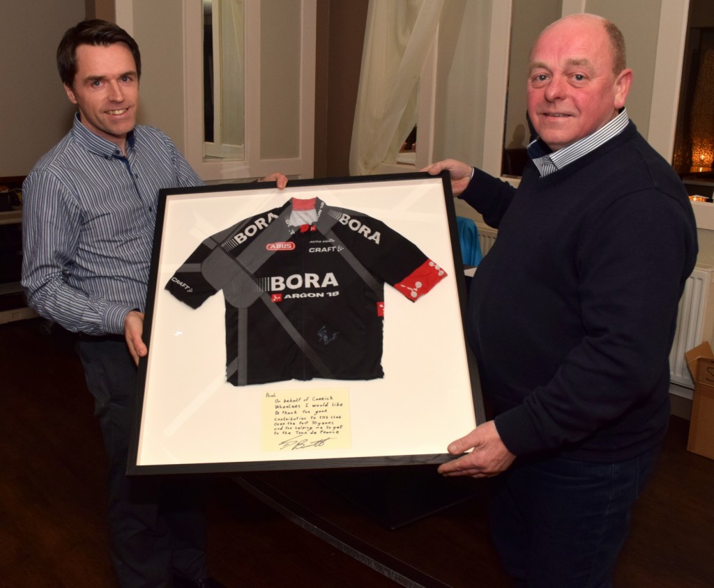 John Dempsey, chairman of Carrick Wheelers C.C. Presenting a Team Bora jersey from Sam Bennett's team to Paul Lonergan who has served 30 years as secretary of the club.